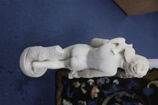 Bouzadou. A carved white marble figure of a nude girl feeding a sheath of corn to a bird on her shoulder, height 29.5in.
